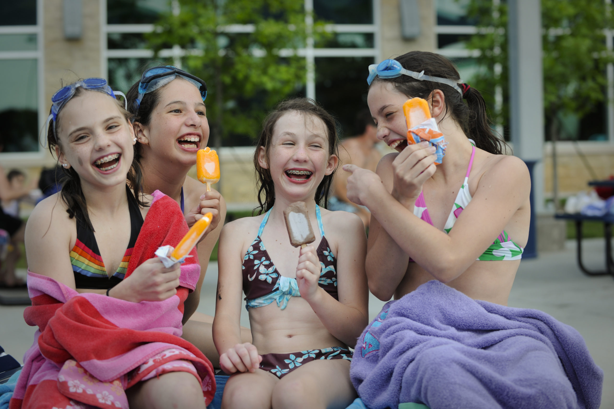 Four girls at a Plano Pools eating ice cream