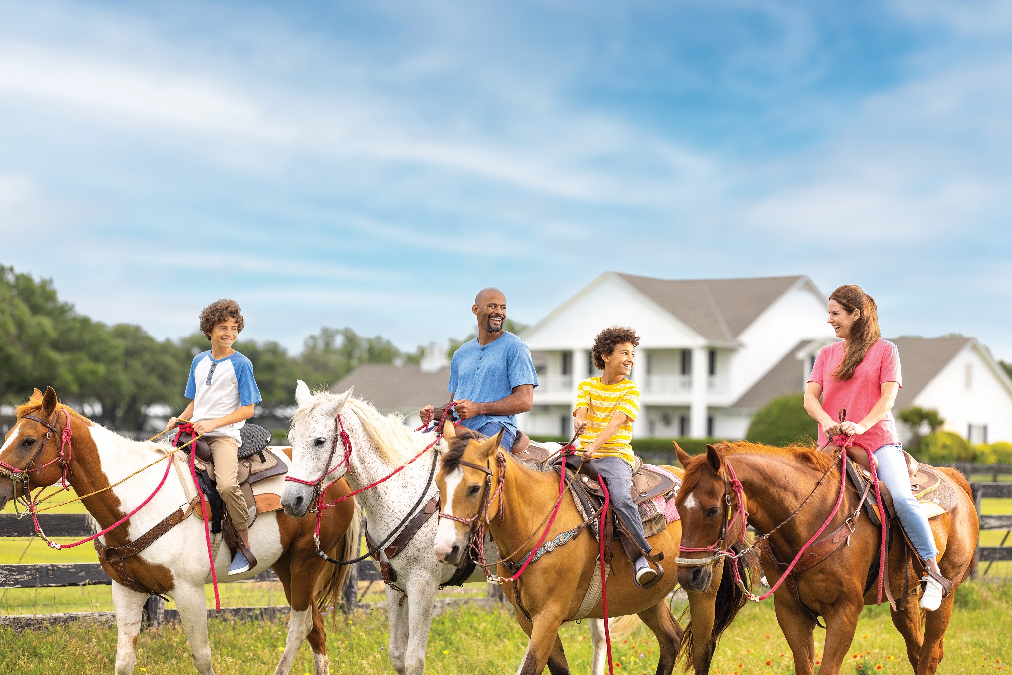Family horseback trail riding at Southfork Ranch; kid-friendly fun