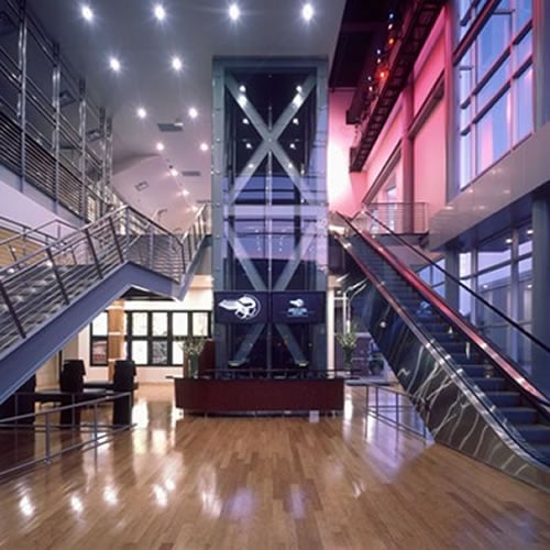 Angelika Film Center lobby and escalator with uplighting