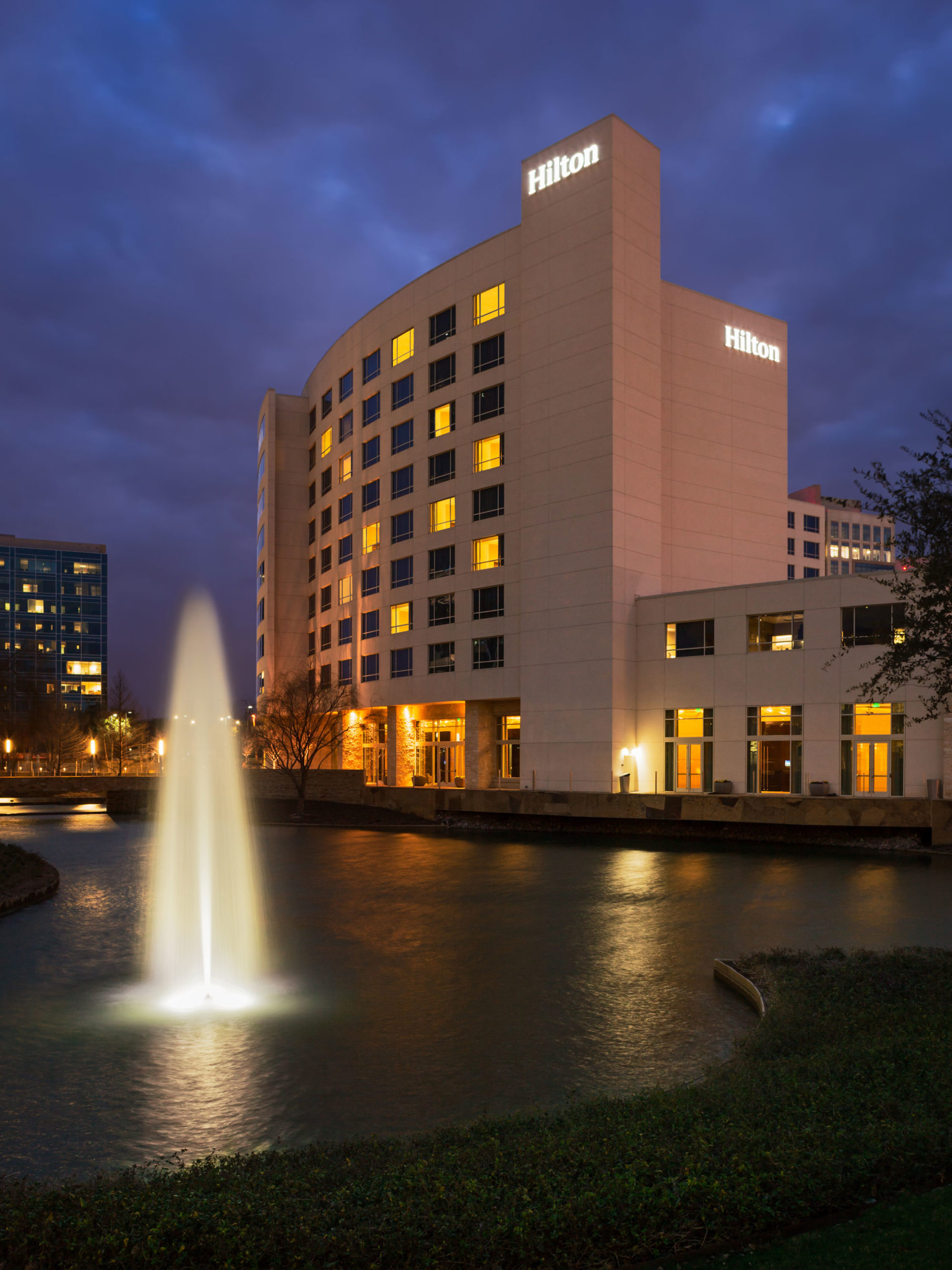 Hilton Dallas Plano Granite Park exterior at dusk