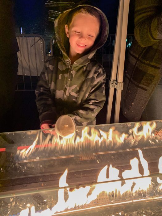 Boy roasting marshmallows at Dickens by Madi Scott