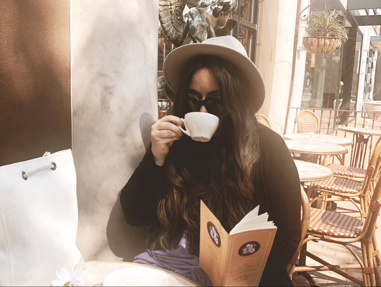 Samantha Ruble drinking tea at Cafe Intermezzo