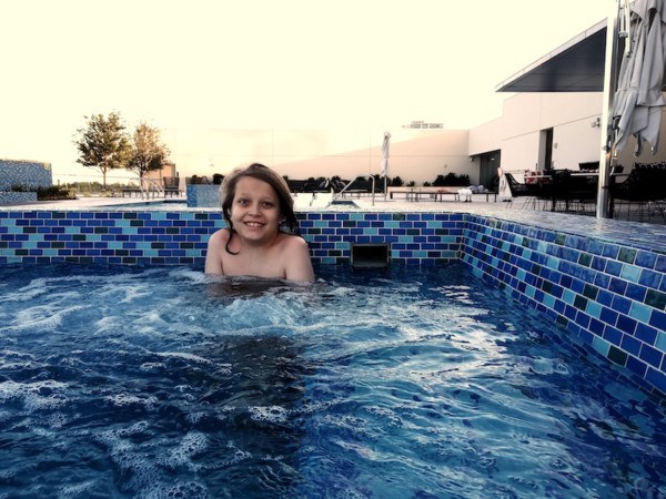Kid in hot tub at Renaissance pool