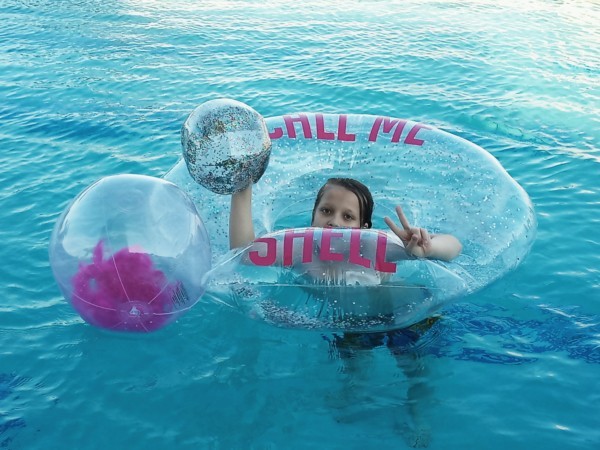 Kid in float at Renaissance pool
