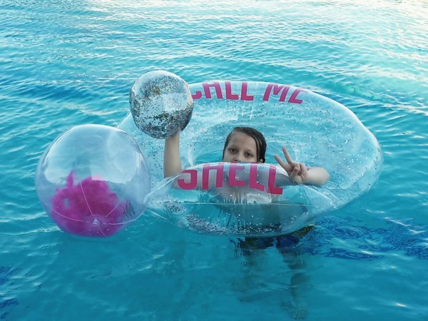 Kid in float at Renaissance pool