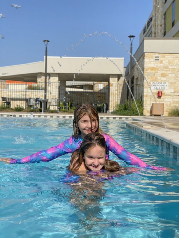 Girls swimming at Home2 Suites pool