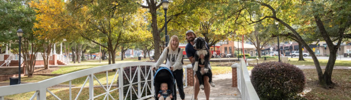 Traveling Newlyweds in Plano at Haggard Park with baby and pup