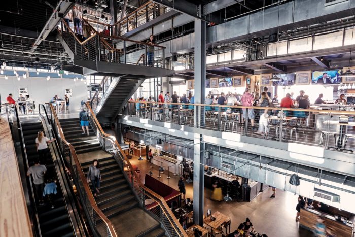 Legacy Hall interior photo of all three levels during the day crowded