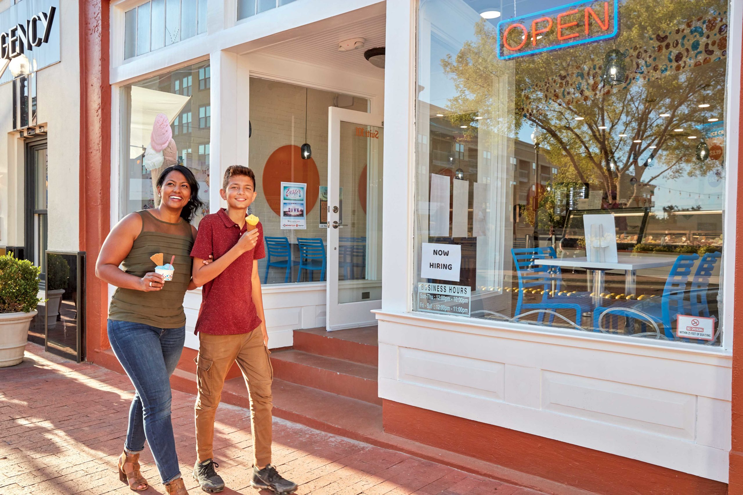 Mom and son eat gelato in downtown Plano