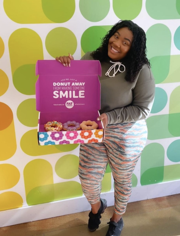 Laurin Curtis, The Life of Jo Jo blogger, posing with donuts at Fat Straws in Plano