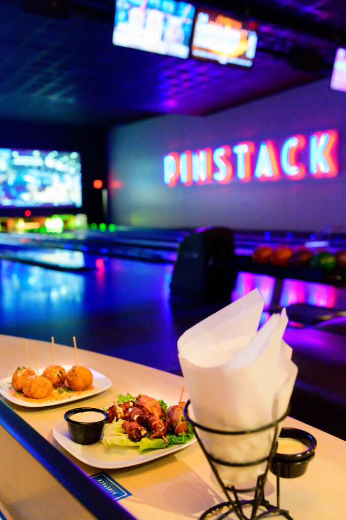 Food at Pinstack with lanes in the background