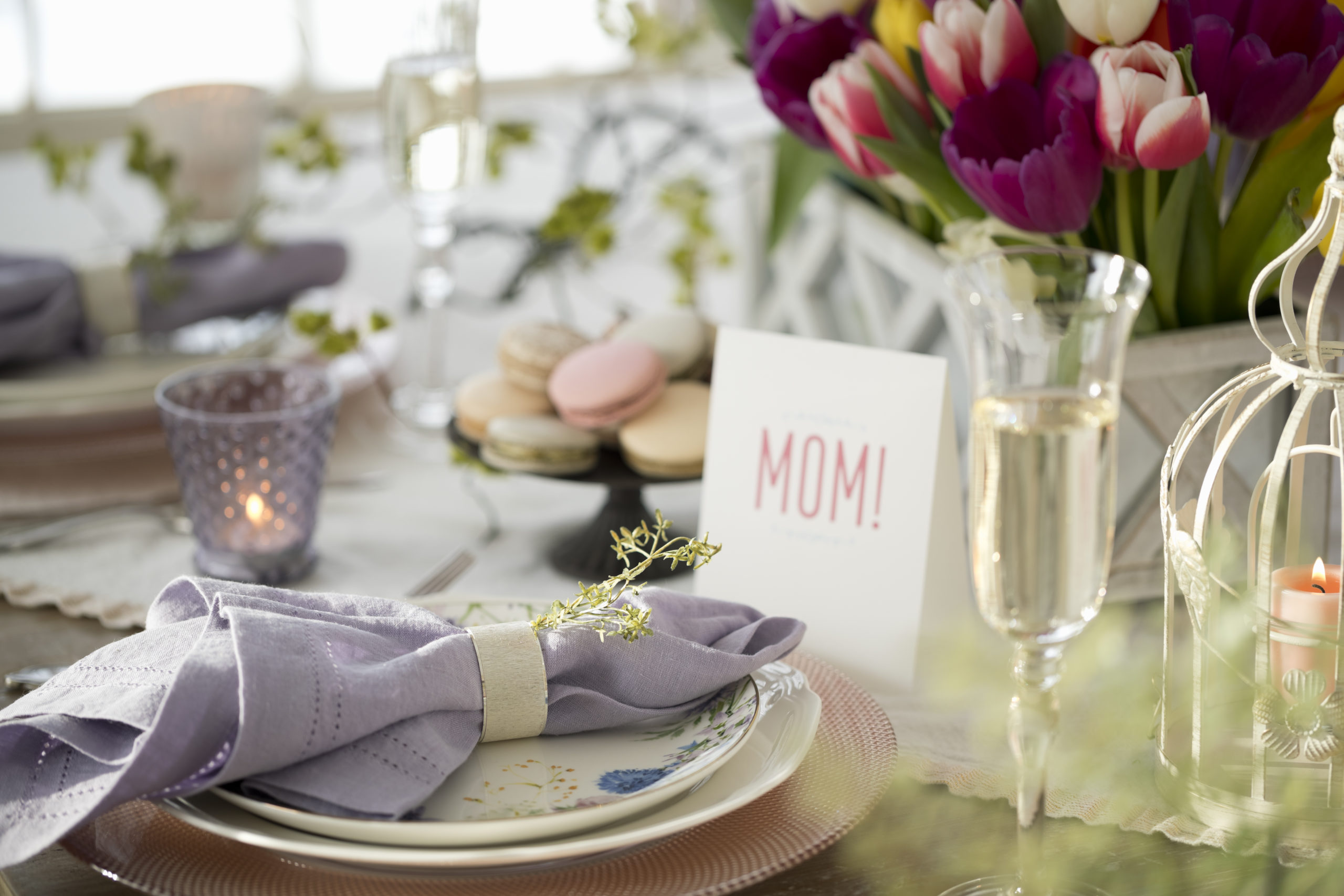 Mother's Day in Plano Texas - table setting with flowers, champagne, and MOM table sign