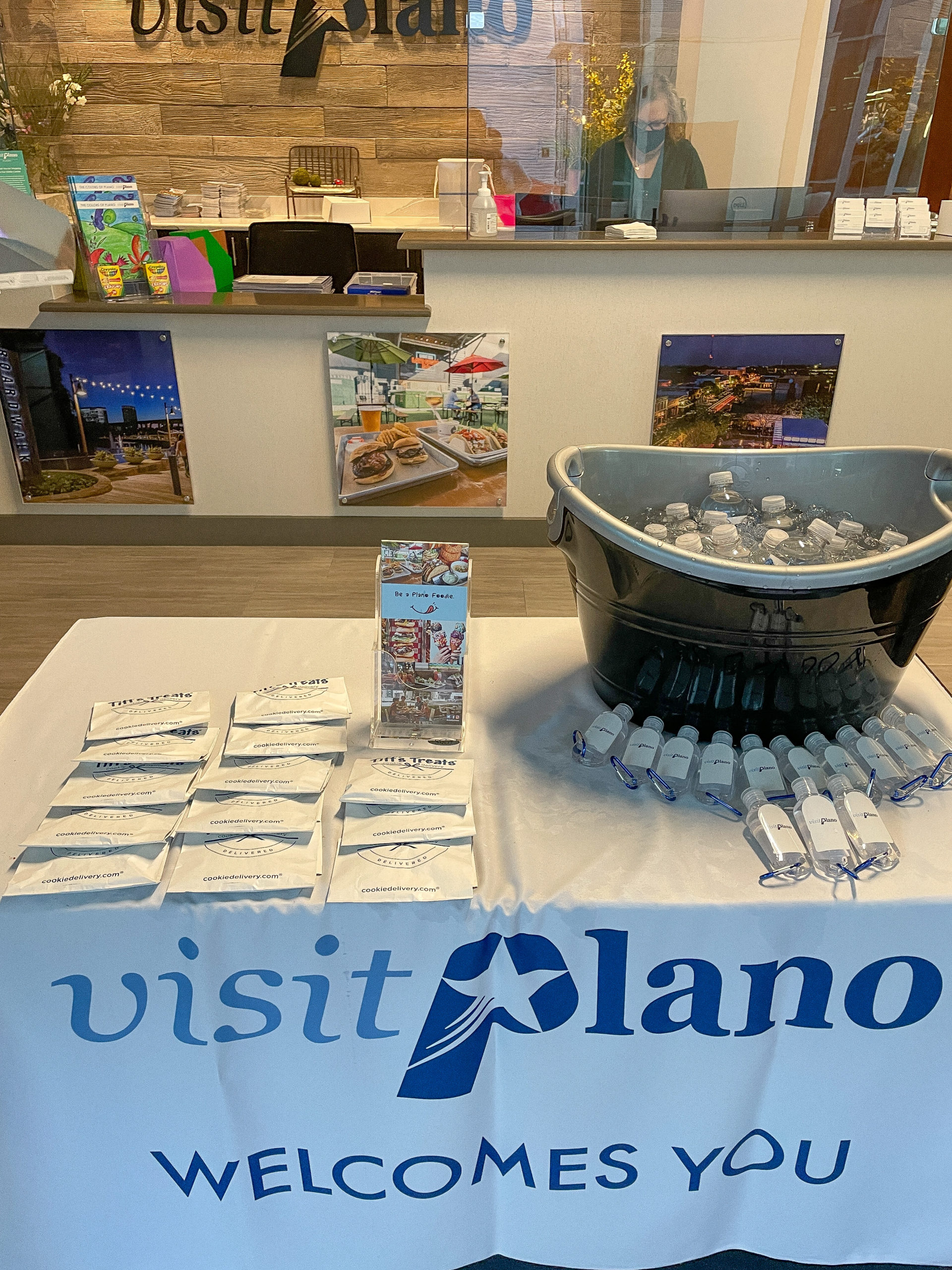 Visit Plano welcome table in Visitor Center at Happy Hour Hike event.