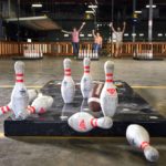 Fowling Warehouse pins knocked over and people cheering
