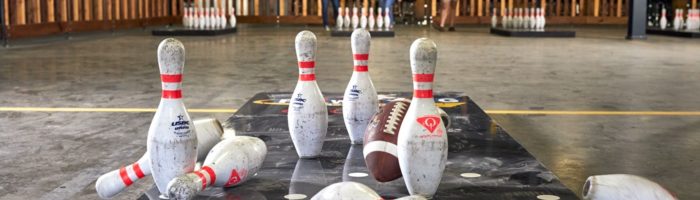 Fowling Warehouse pins knocked over and people cheering