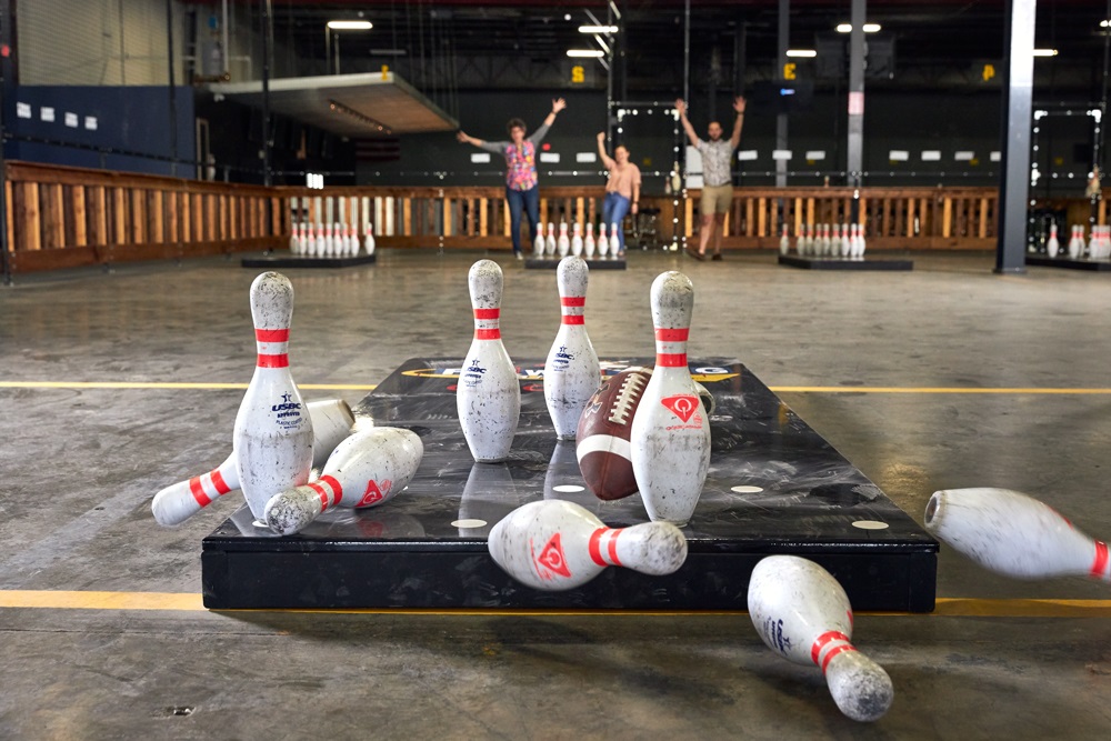 Fowling Warehouse pins knocked over and people cheering