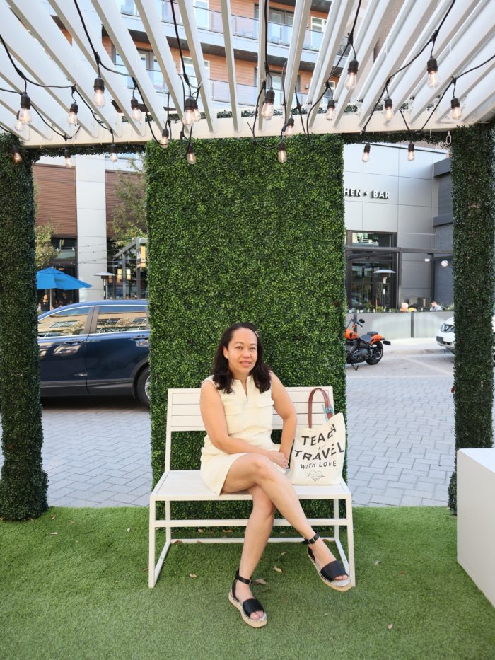 Rory sitting in a photo-op installation at Legacy West in Plano.