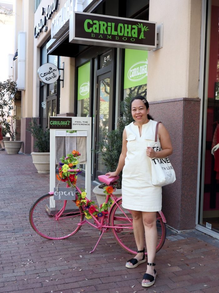 Rory poses with a pink bike while shopping at The Shops at Legacy in Plano.