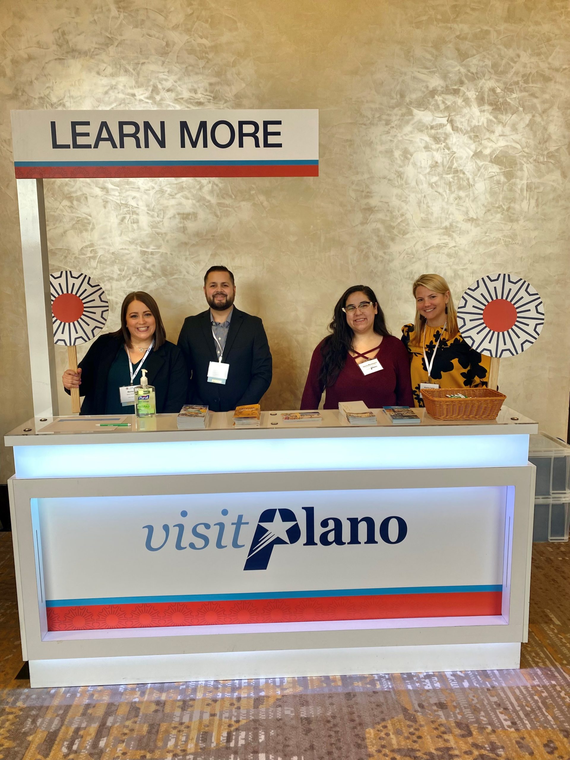 Visit Plano team at a welcome booth.