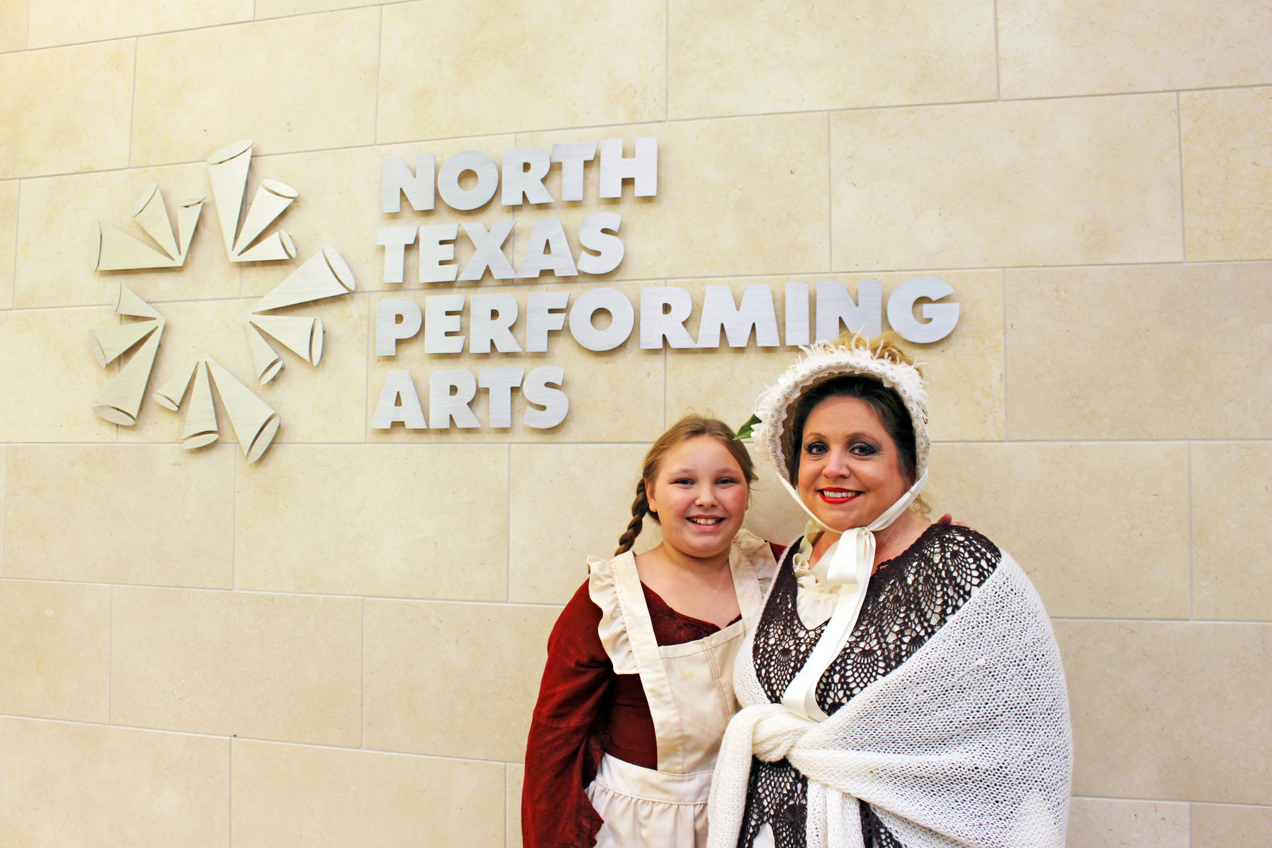 North Texas Performing Arts sign and actresses