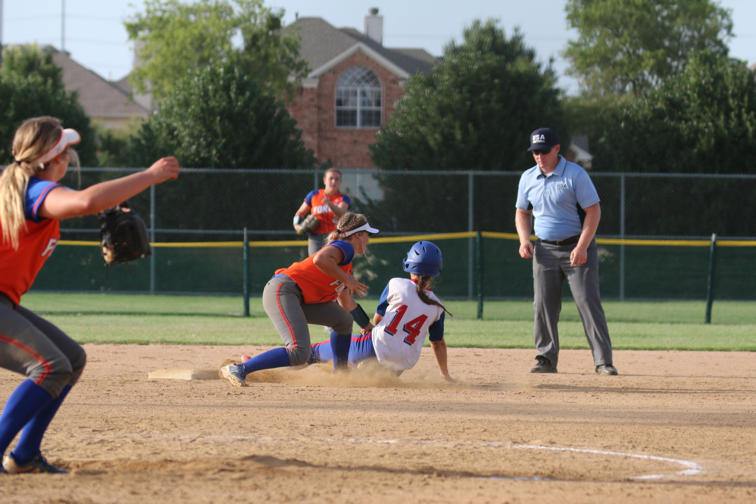 USA Softball out at base