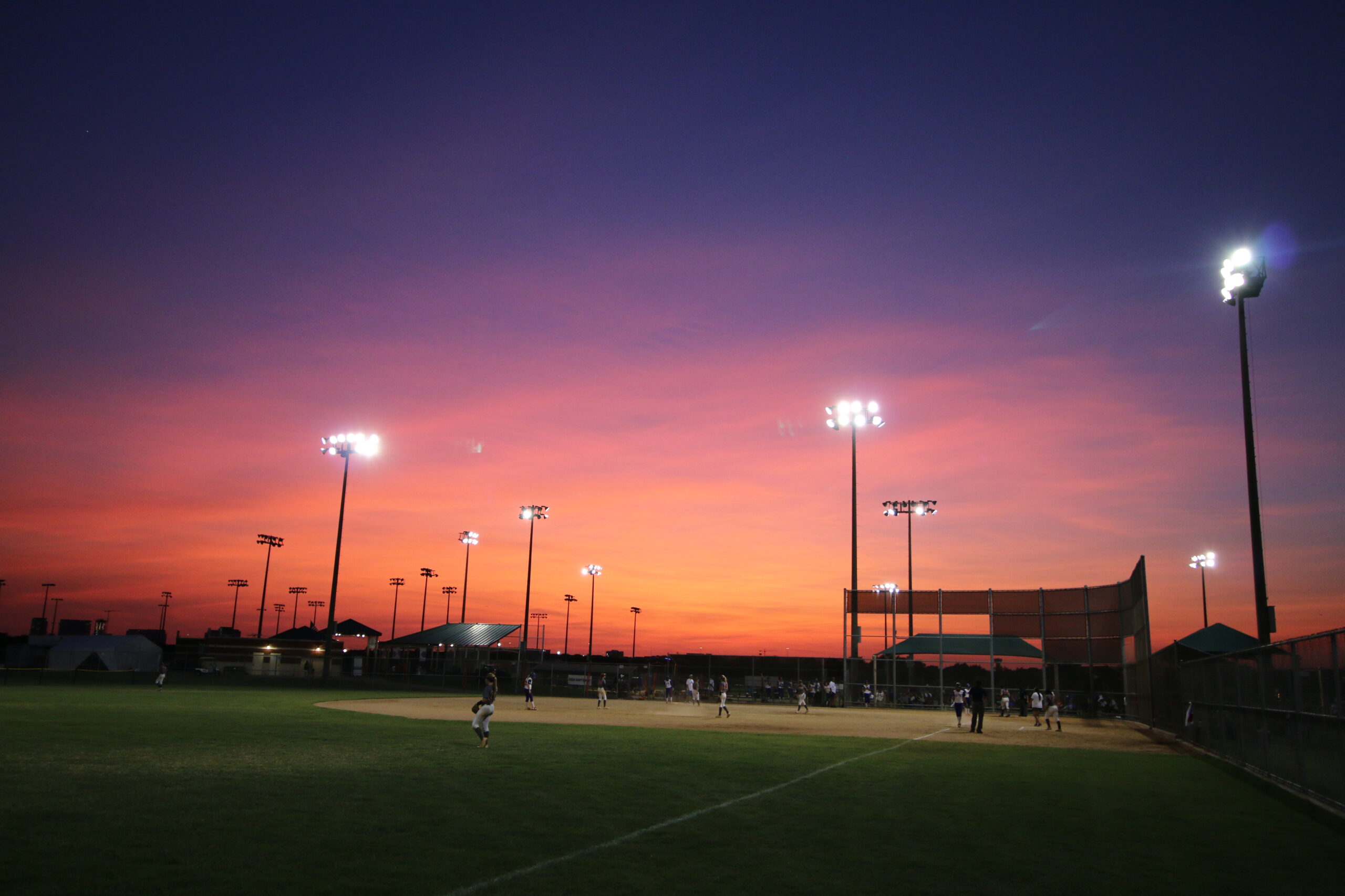 USA Softball purple sunset and field