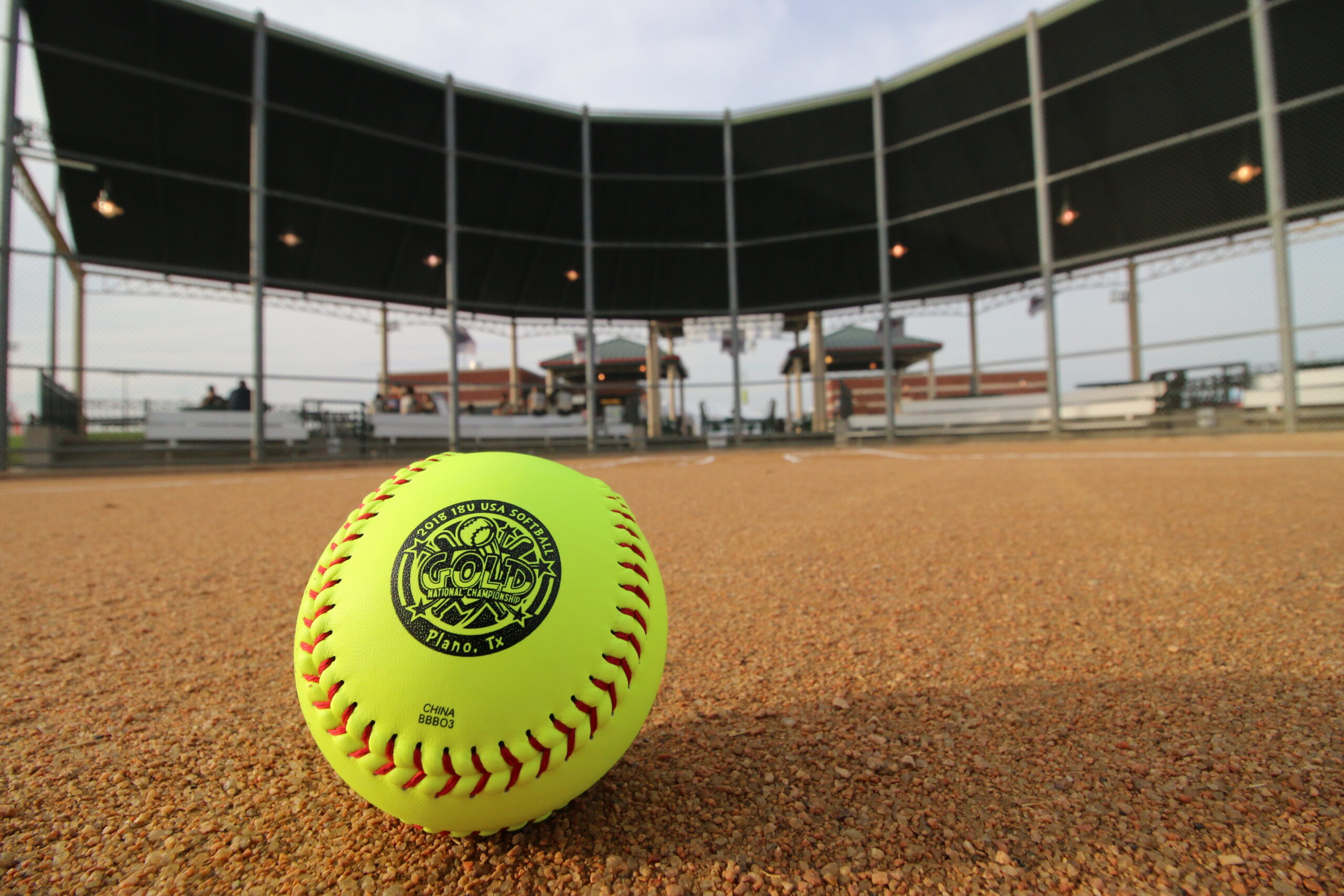 USA Softball game ball and field