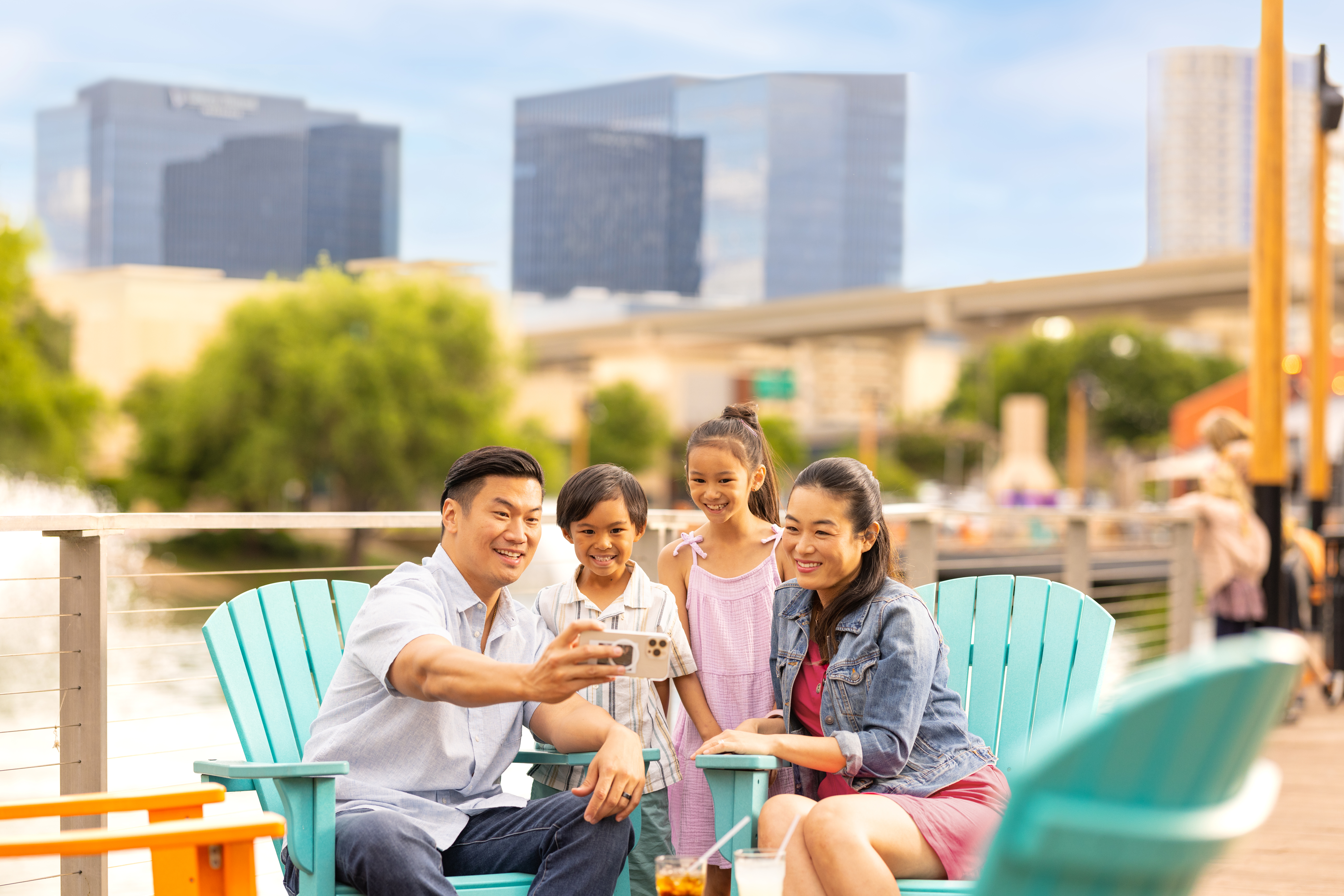 Family sitting taking a selfie at The Boardwalk at Granite Park