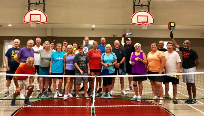 Pickleball club posing at Carpenter Park Recreation Center gym