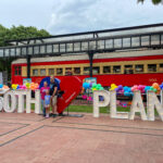 Plano 150th birthday t-shirt event marquee letters spelling out 150th Plano with the loveplano heart in the middle and the Interurban Railway Museum train in the background