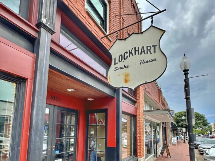 Exterior Lockhart Smokehouse sign in downtown Plano, TX during Jenna's girlfriend getaway