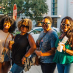 Happy Hour with group of friends having fun and touring together outdoors.