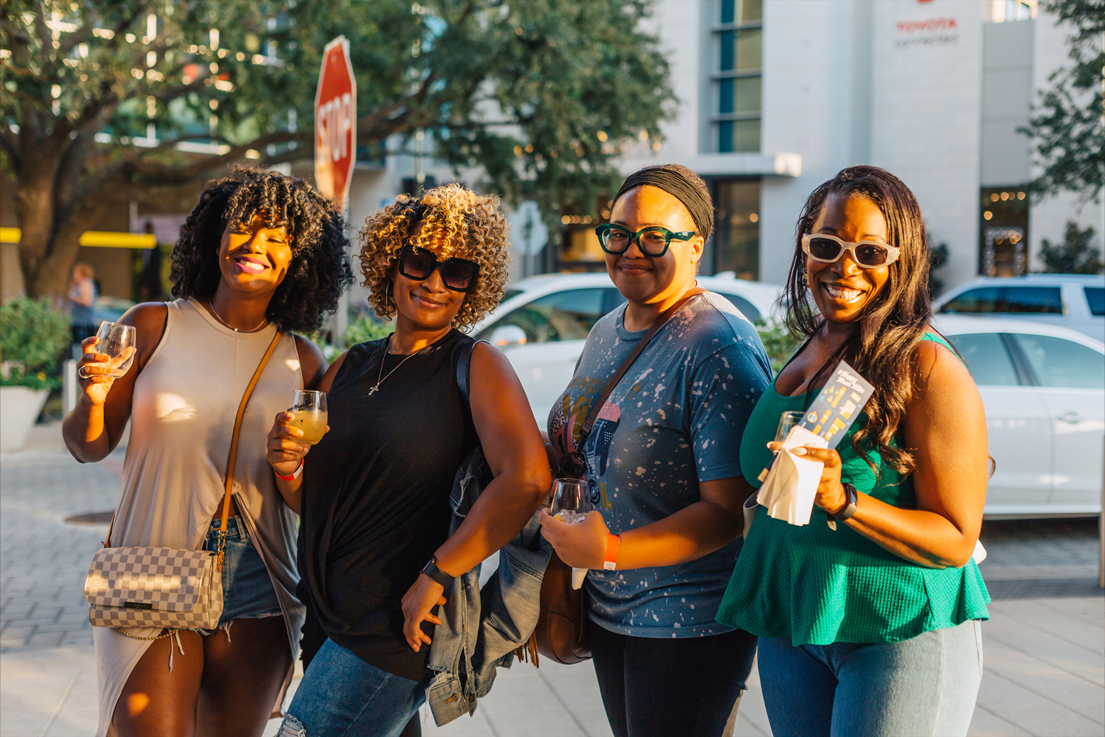 Happy Hour with group of friends having fun and touring together outdoors.