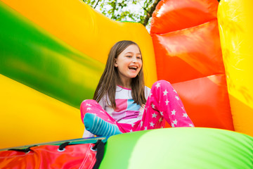 Little girl with Bounce House Adobe Stock Photo