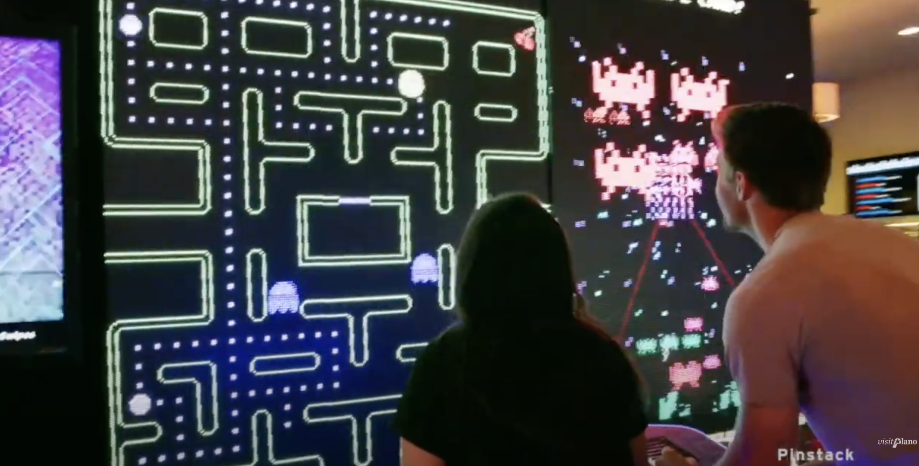 Pinstack - Couples interacting with arcade games.