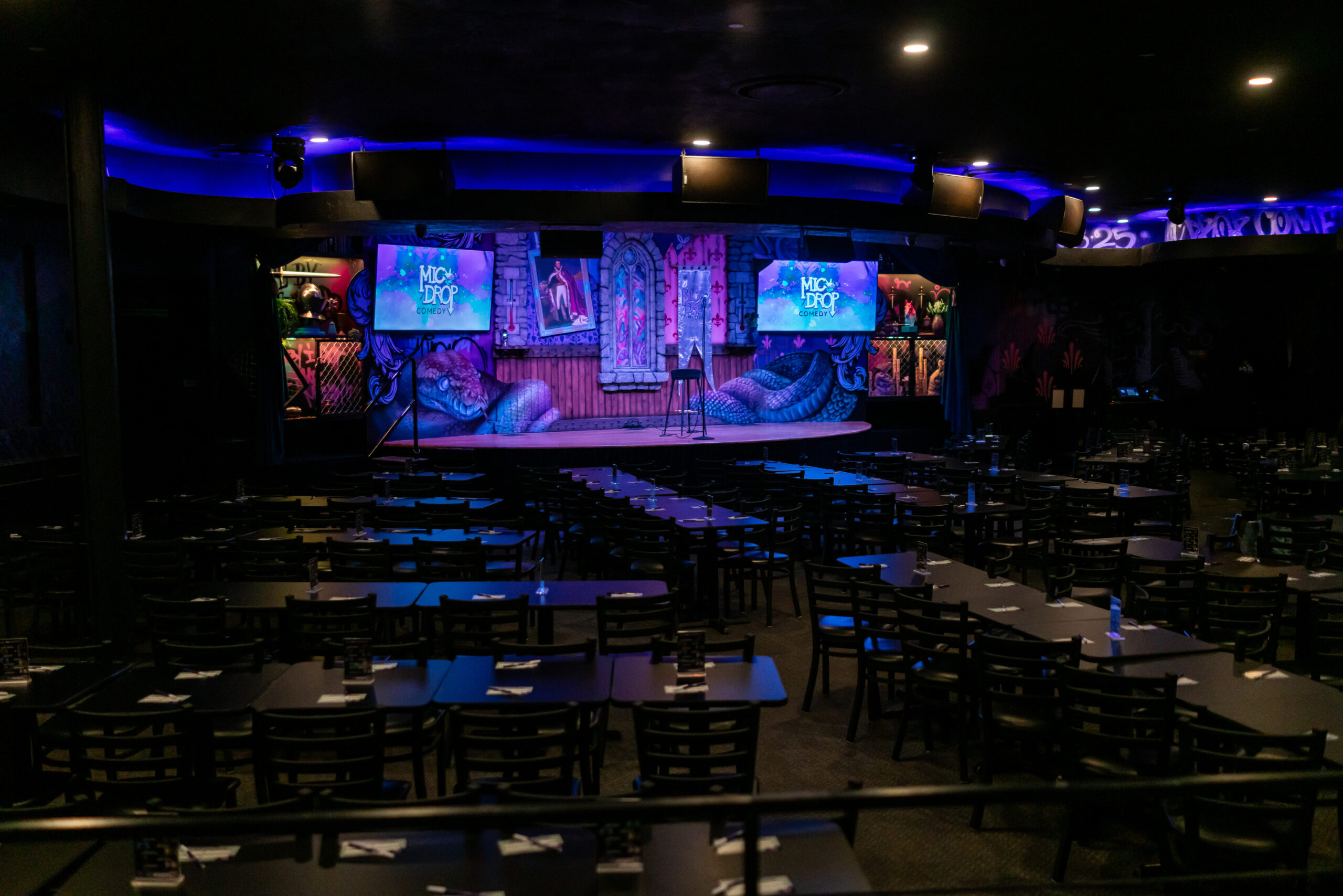 Mic Drop Comedy stage and audience tables and chairs
