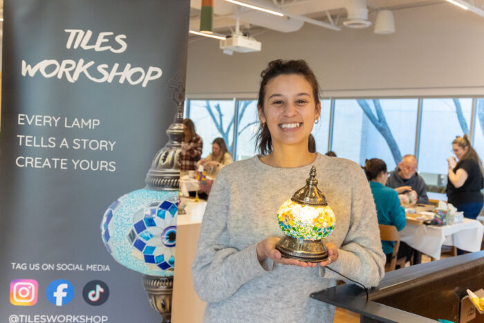 Tiles Workshop - Mosaic Lamp Workshop woman posing with her lamp