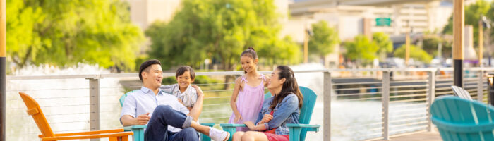 Family sitting in chairs on the Boardwalk