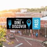 A sunlit street scene in Plano, Texas, with people walking on a brick road by historic buildings. A Plano Dine & Discover Pass graphic overlay features a fork, map pin, and blue pass icon.