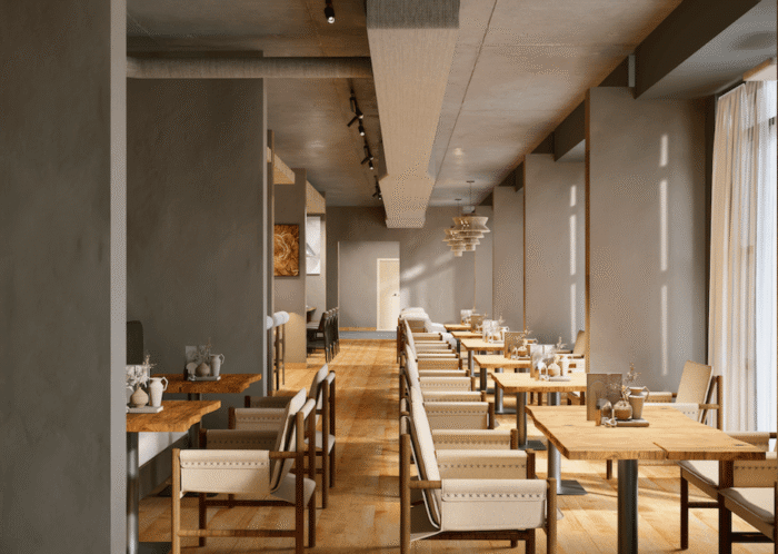Modern, minimalist restaurant interior with wooden floors, beige upholstered chairs, and wooden tables arranged in rows. Soft light filters through large windows on the right, creating a warm and inviting atmosphere.