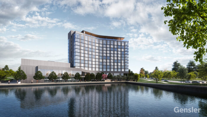 A modern multi-story hotel building with large windows stands beside a reflective body of water, surrounded by trees and greenery, under a partly cloudy sky. The Gensler logo appears in the bottom right corner.