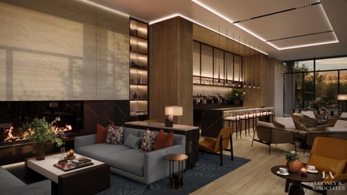 A modern lounge with a fireplace, stylish sofas, a sleek bar with high stools, warm lighting, and floor-to-ceiling windows. The space has elegant decor, wood accents, and looks inviting and cozy.